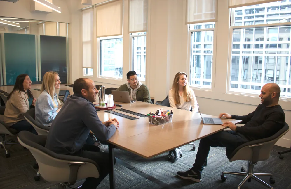 The Spin team gathered around a meeting table